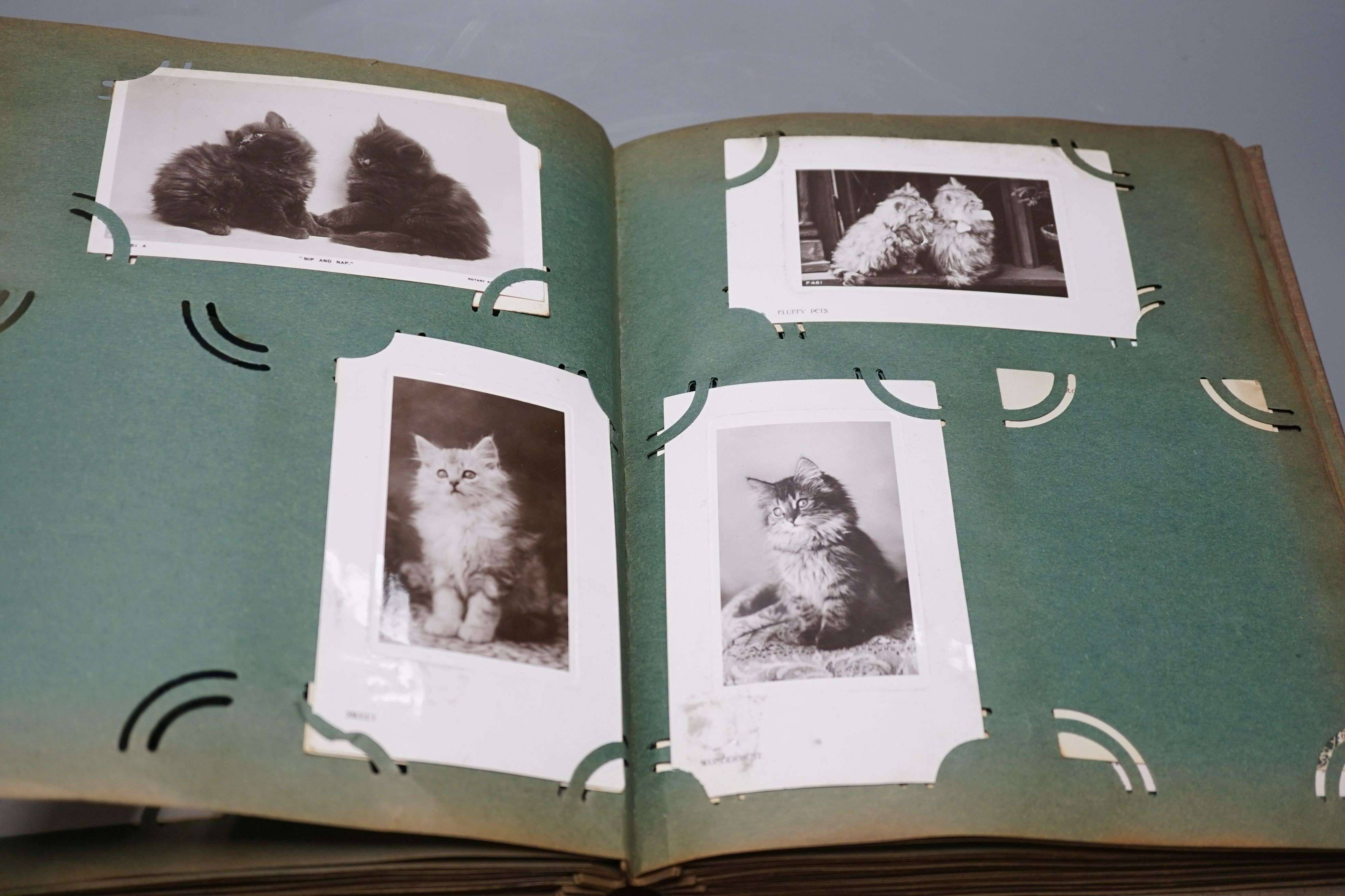 Three postcard albums and contents